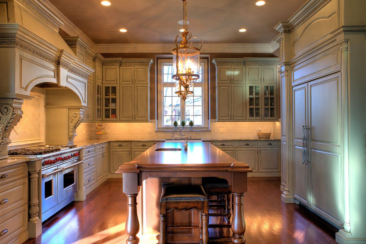 A large kitchen with a large island in the middle