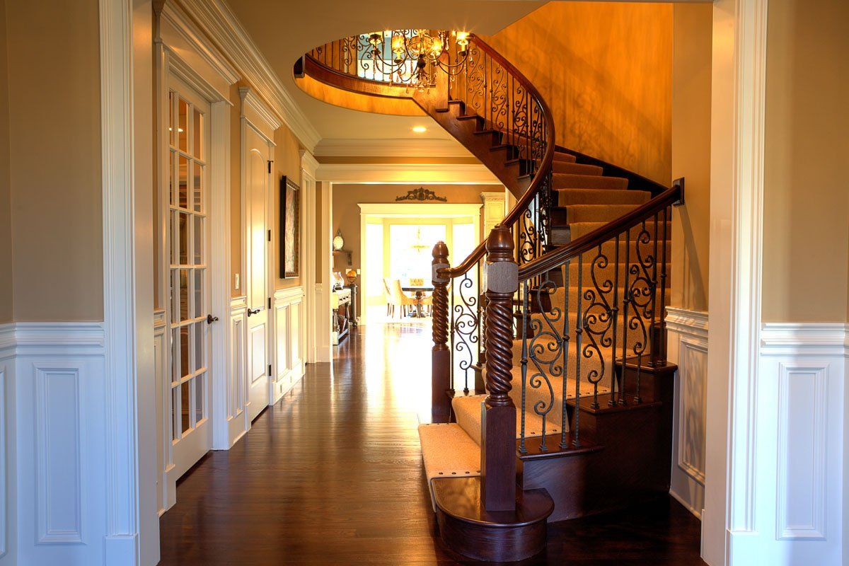 A hallway with a spiral staircase in the middle