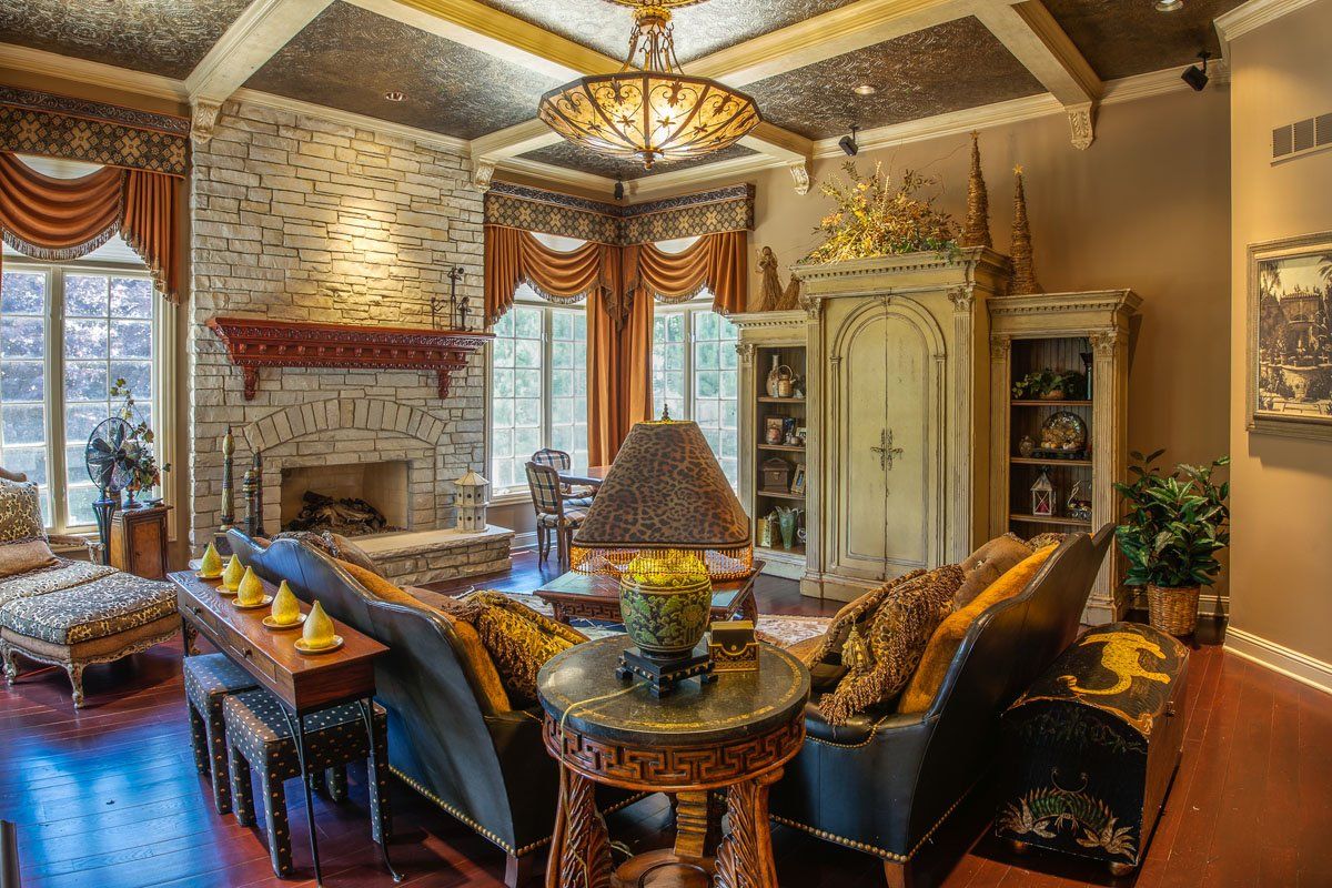 A living room filled with furniture and a fireplace.