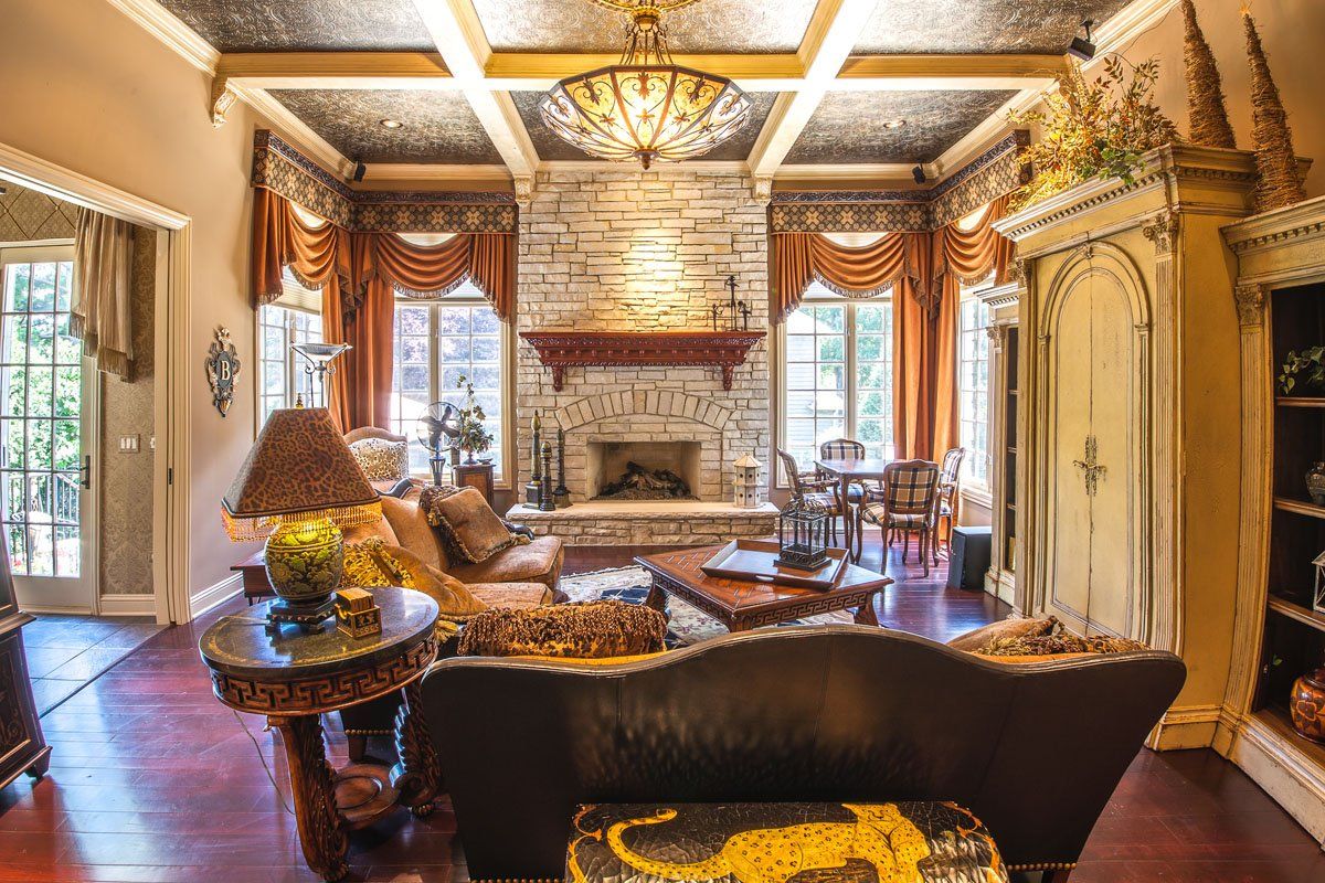 A living room filled with furniture and a fireplace.