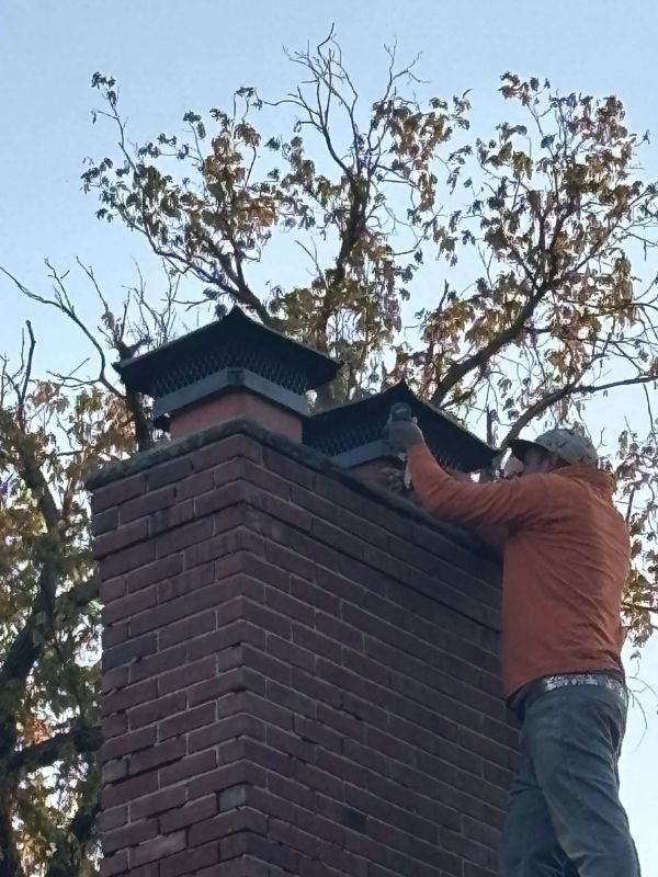 Chimney cap replacement performed by local roofing specialists.