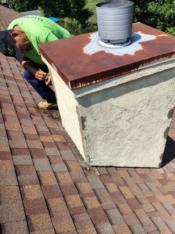 Chimney cap replacement by Eli’s Roofing
