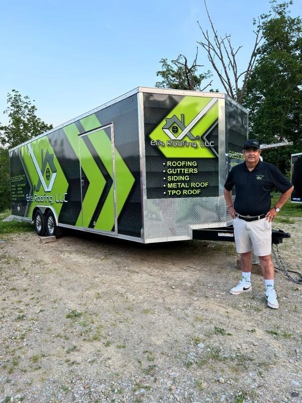 Eli with trailer visible at tile roof replacement project

