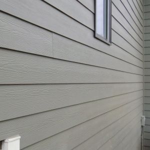Fiber cement siding installed on home by Eli’s Roofing
