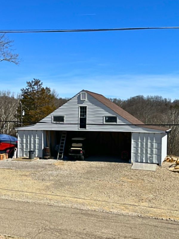Siding painting project completed by local home improvement specialists.
