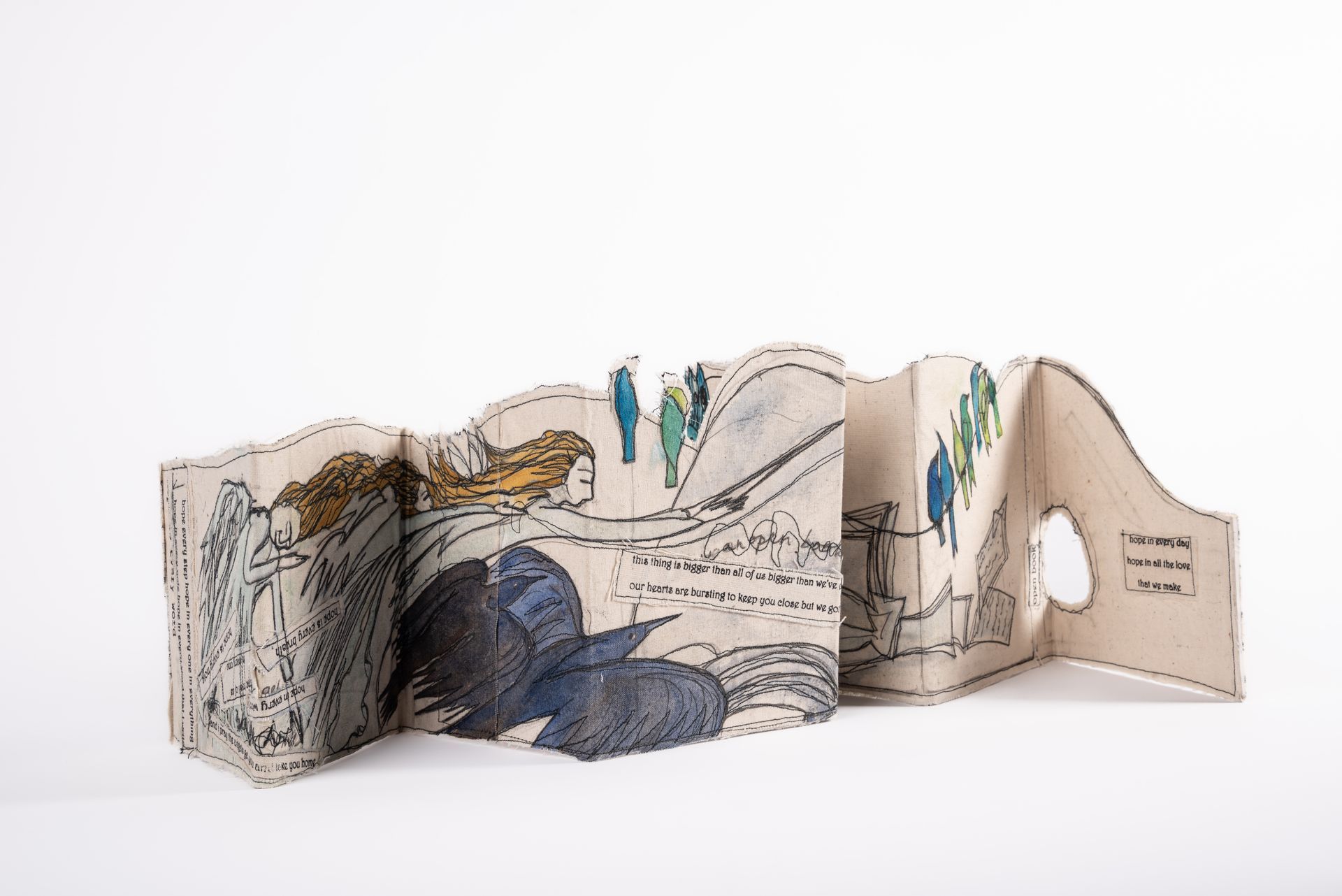 Accordion book with illustrations: woman, bird, buildings, text. Beige, blue, green, brown.