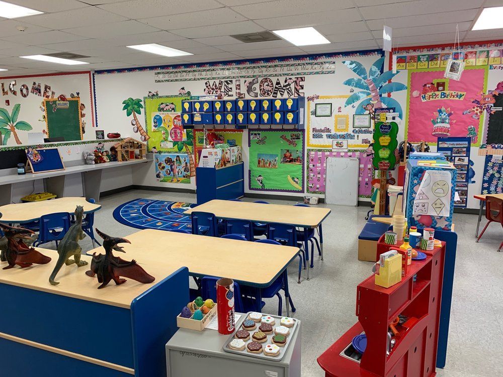 A classroom with a welcome sign on the wall