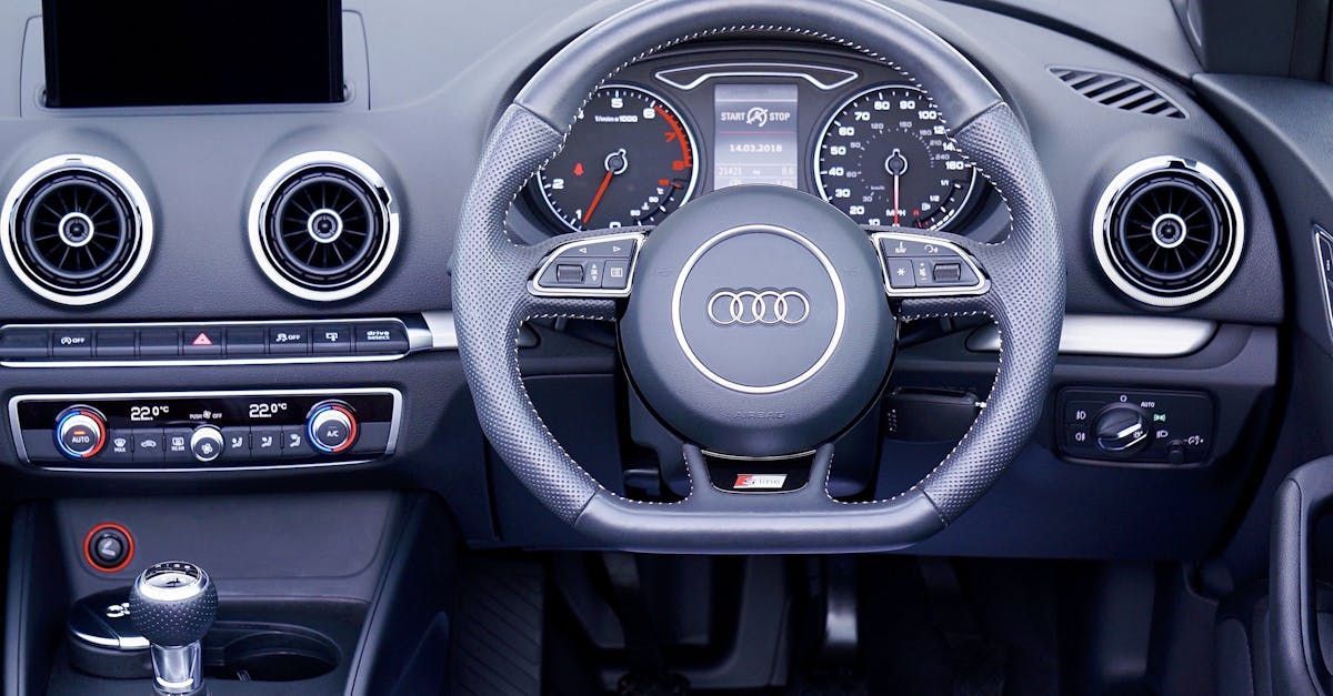 The interior of an audi car with a steering wheel and dashboard.  | Hardey's MotorWerks