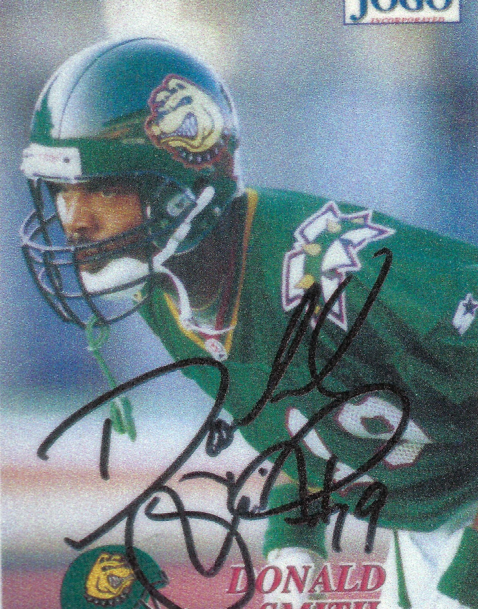 A signed football card of a man wearing a helmet