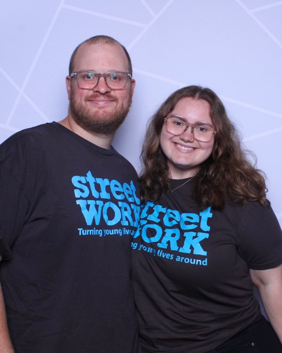 Two people wearing matching 