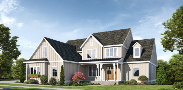 Beige farmhouse with black roof, white trim, and a small porch. Lush green lawn and trees in the background.