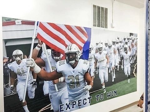 A blue wall with a sign that says companion insurance agency