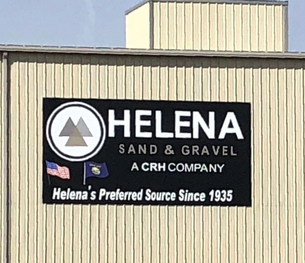 A white building with a sign that says jsuites salon spa suites.