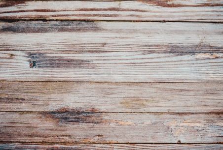 Weathered wooden planks, shades of brown and gray.