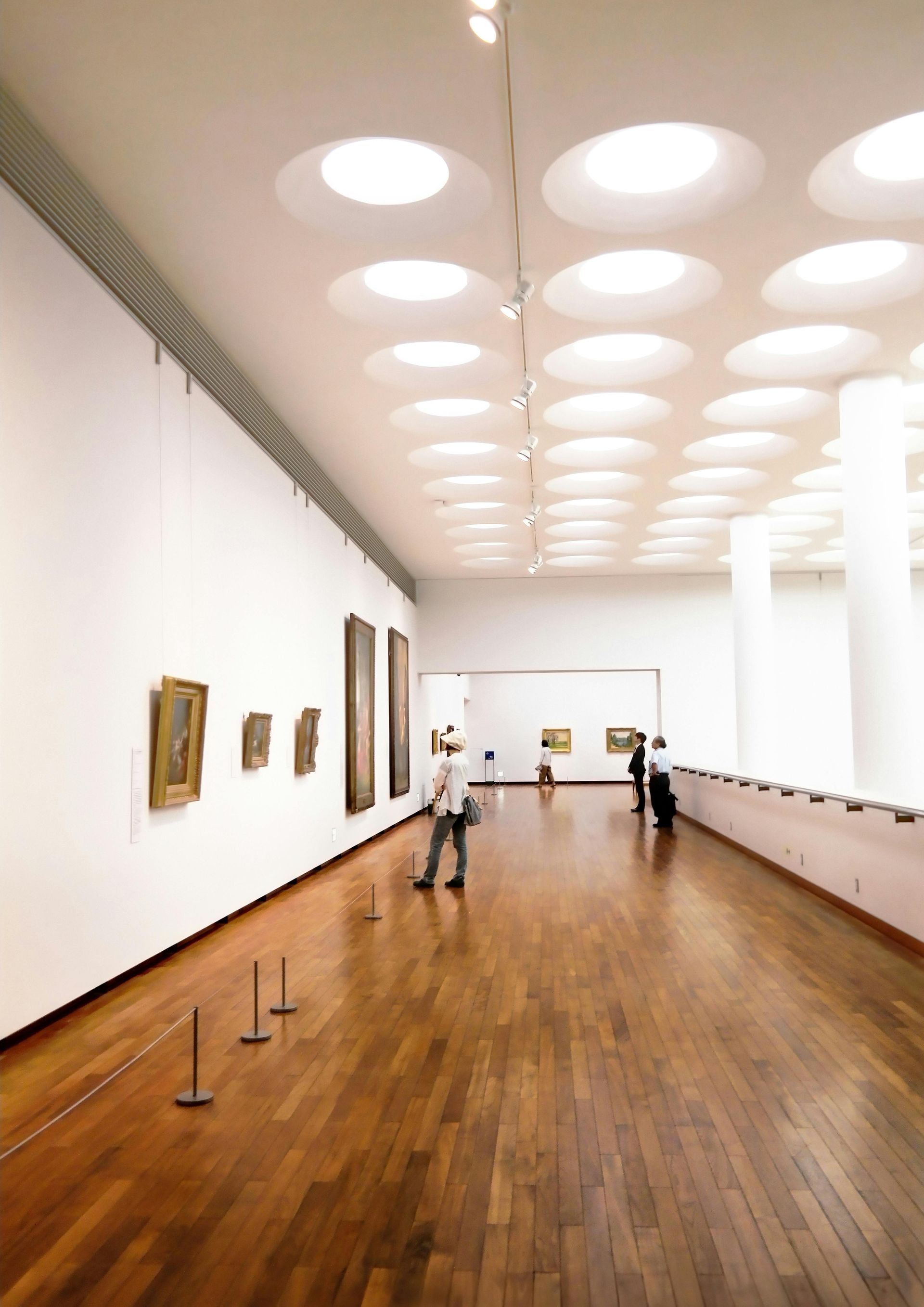 art gallery with wooden flooring