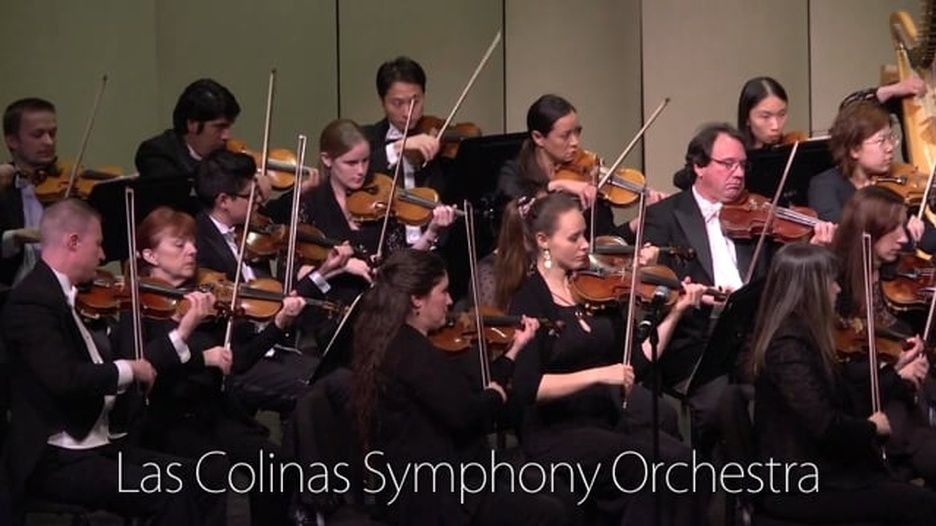 The Las Colinas Symphony Orchestra is performing on stage