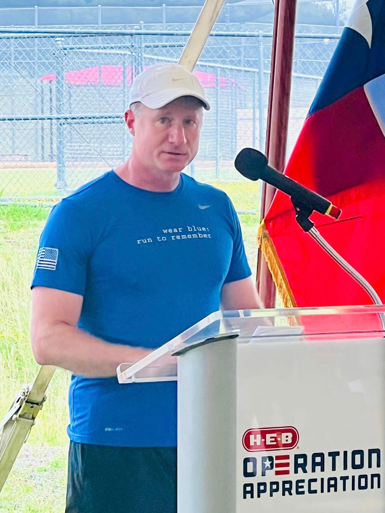 A man is standing at a podium that says operation appreciation