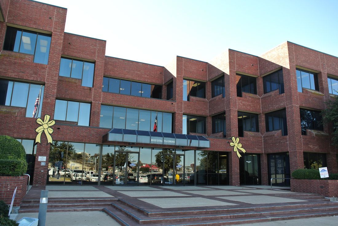 A large brick building with a lot of windows