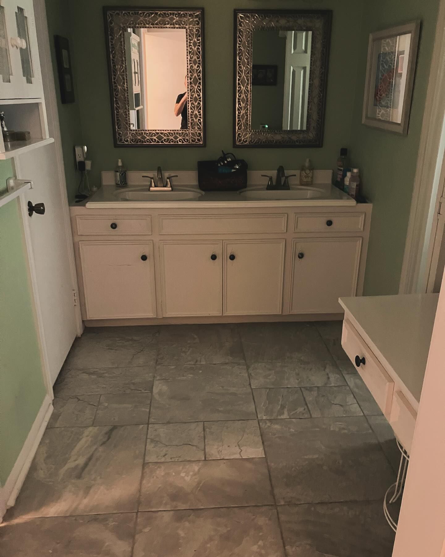 A bathroom with two sinks and two mirrors