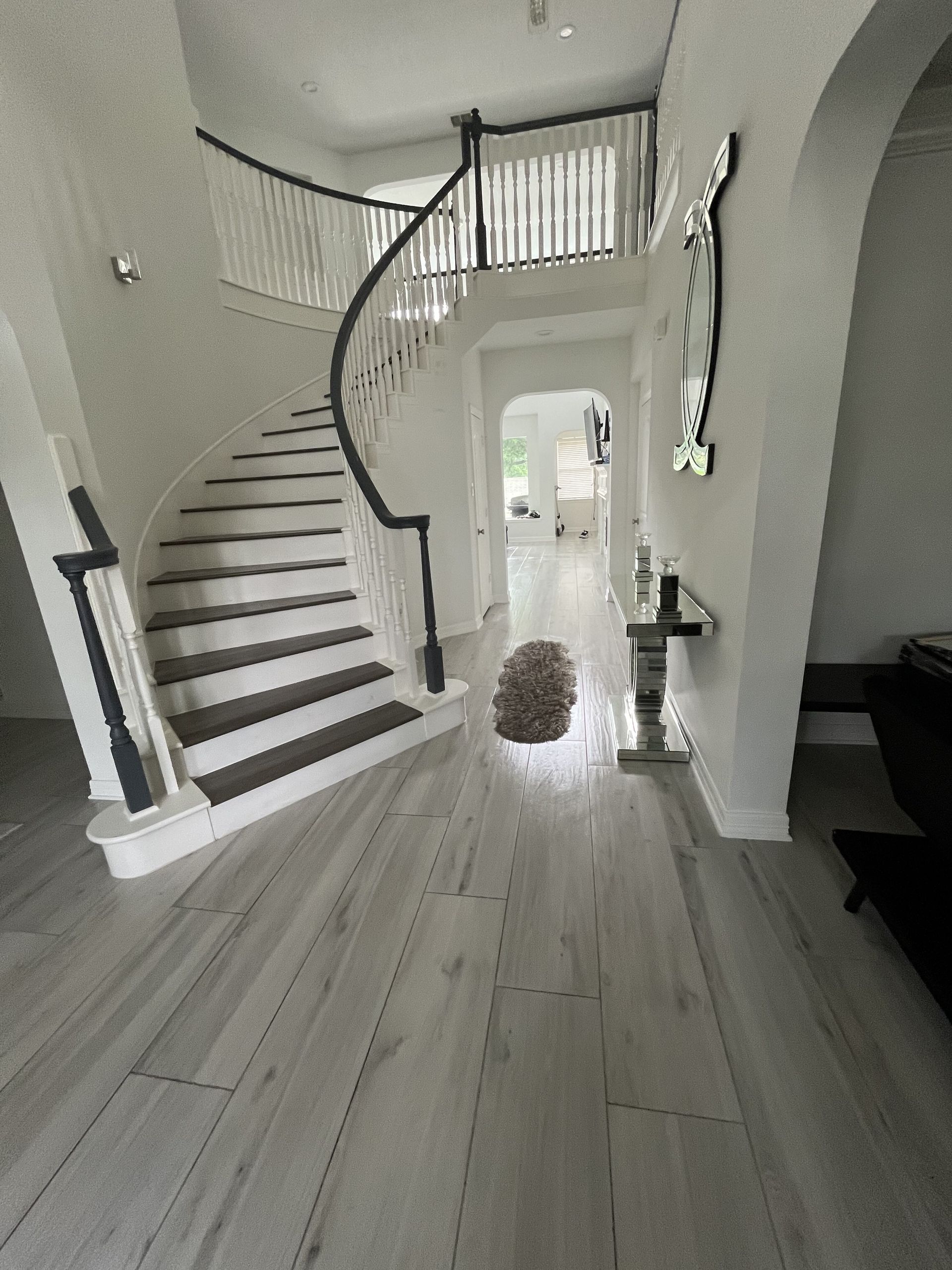 There is a staircase in the middle of the hallway.