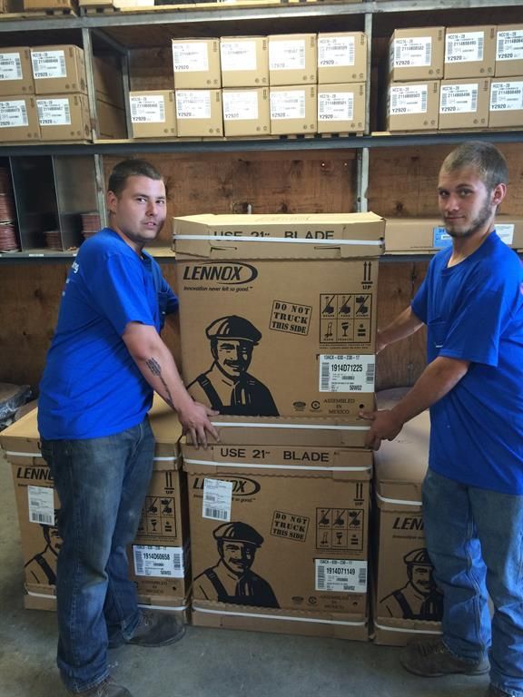 Two Men Carrying Boxes - New Castle, PA - Central Heating & Plumbing