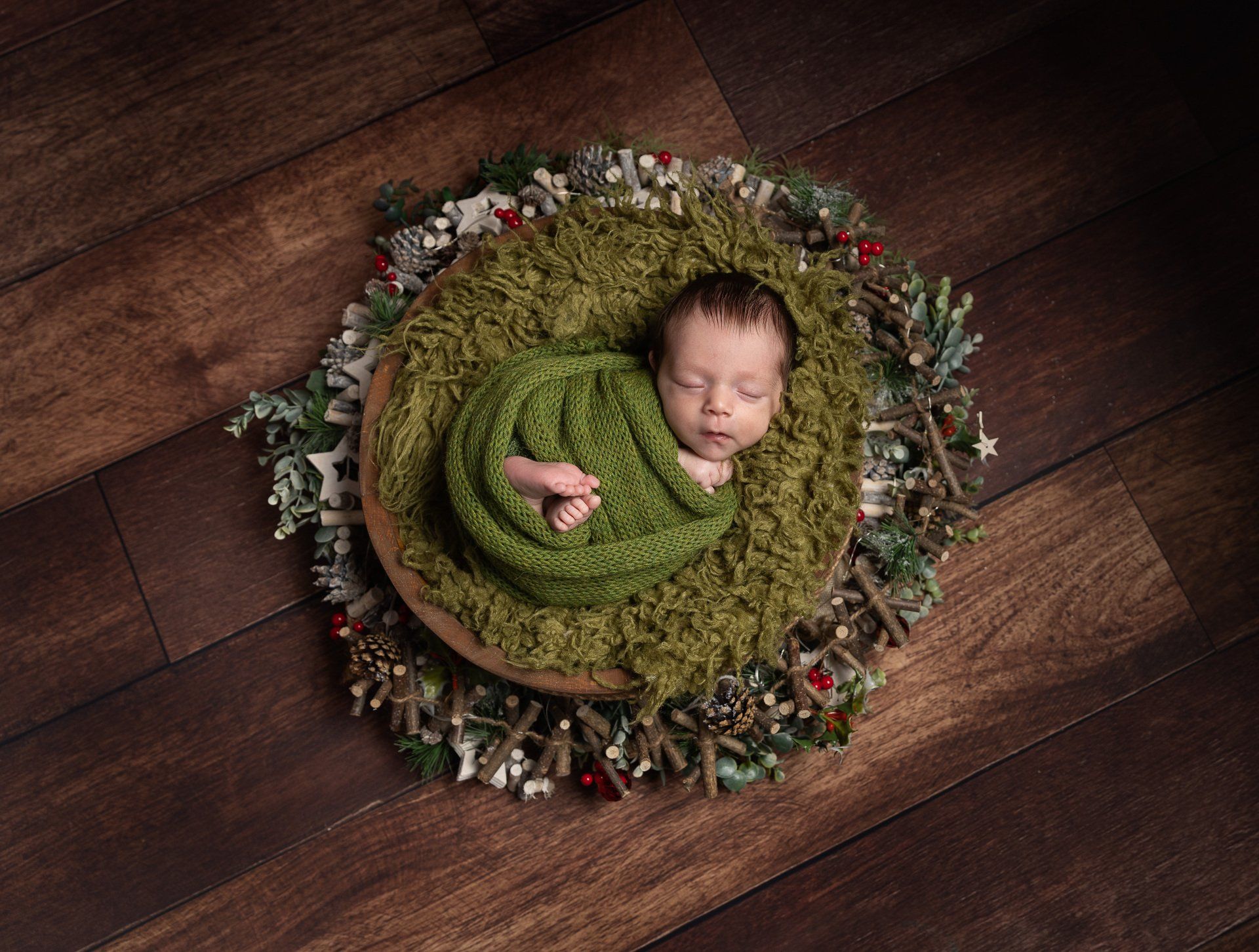 Newborn baby in green
