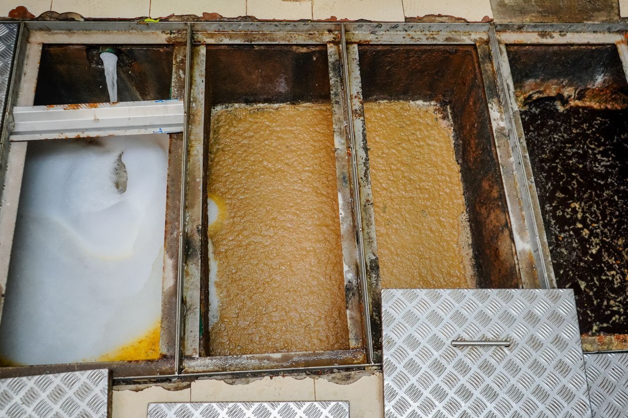 A group of containers filled with different types of grains.