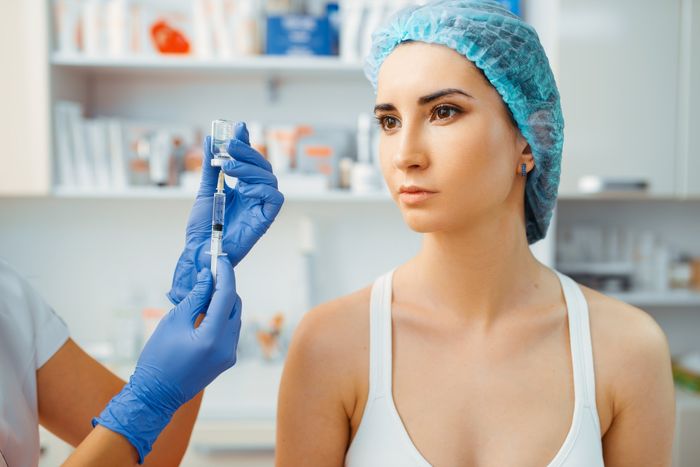 White woman looking to her right waiting to get a collagen treatment