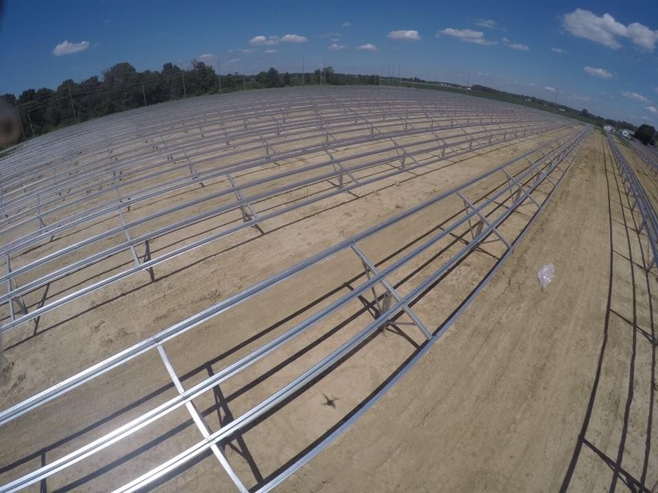 An aerial view of a field of solar panels