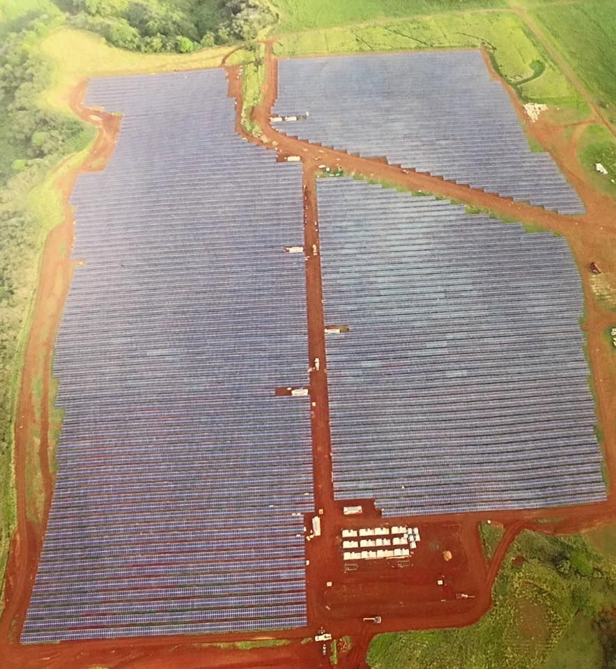 An aerial view of a large field of solar panels