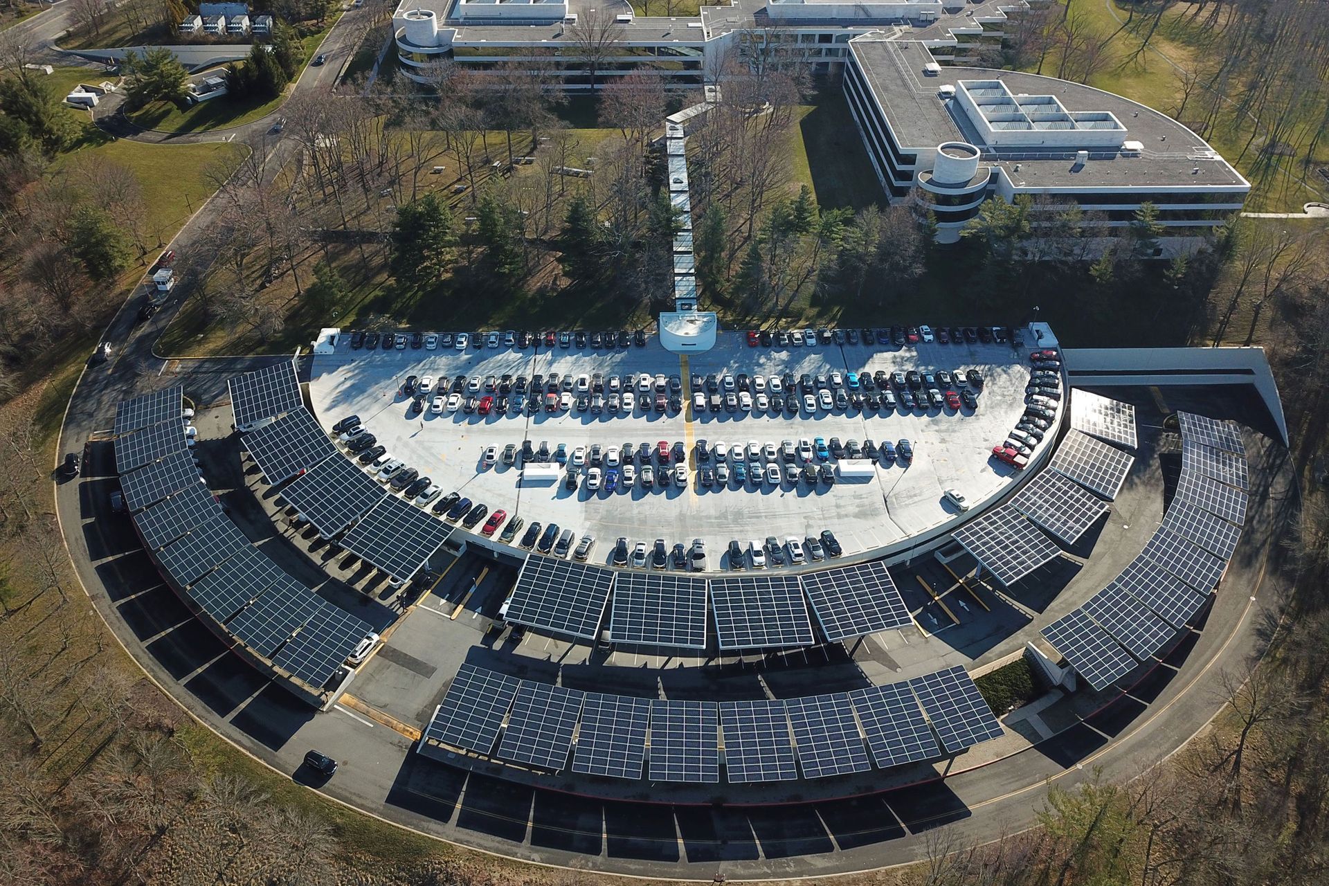 Large Canopy Solar Panel System surrounding a large semi-circle shaped parking lot