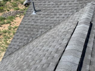 A close up of a roof with a skylight on it