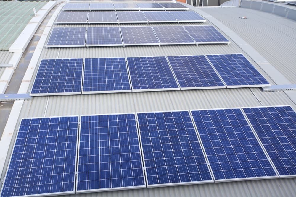 A Row Of Solar Panels On The Roof Of A Building — Evolution Solar Kingaroy in Kingaroy, QLD
