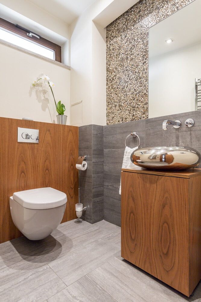 A Bathroom With A Toilet, Sink And Mirror — Evolution Solar Kingaroy in Kingaroy, QLD