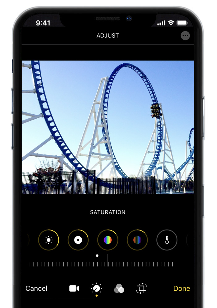 A roller coaster is being edited on a cell phone.