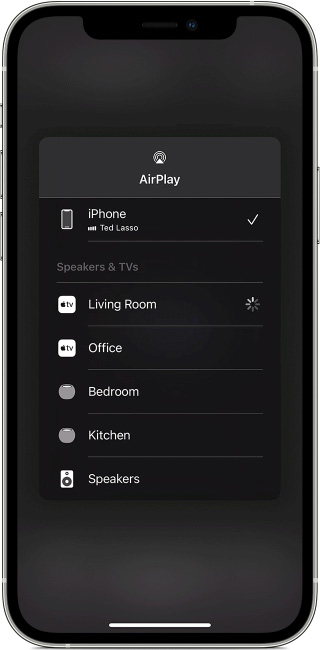 A cell phone with a remote control on it.