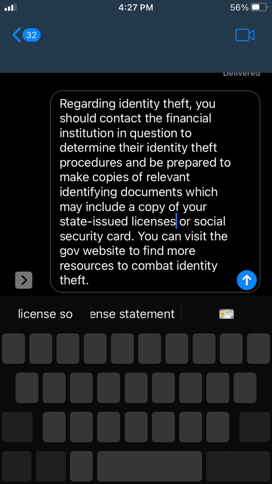 A cell phone screen shows a message about identity theft.