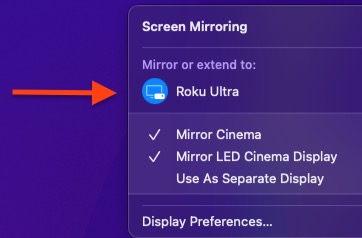 A purple screen with a red arrow pointing to the screen mirroring menu