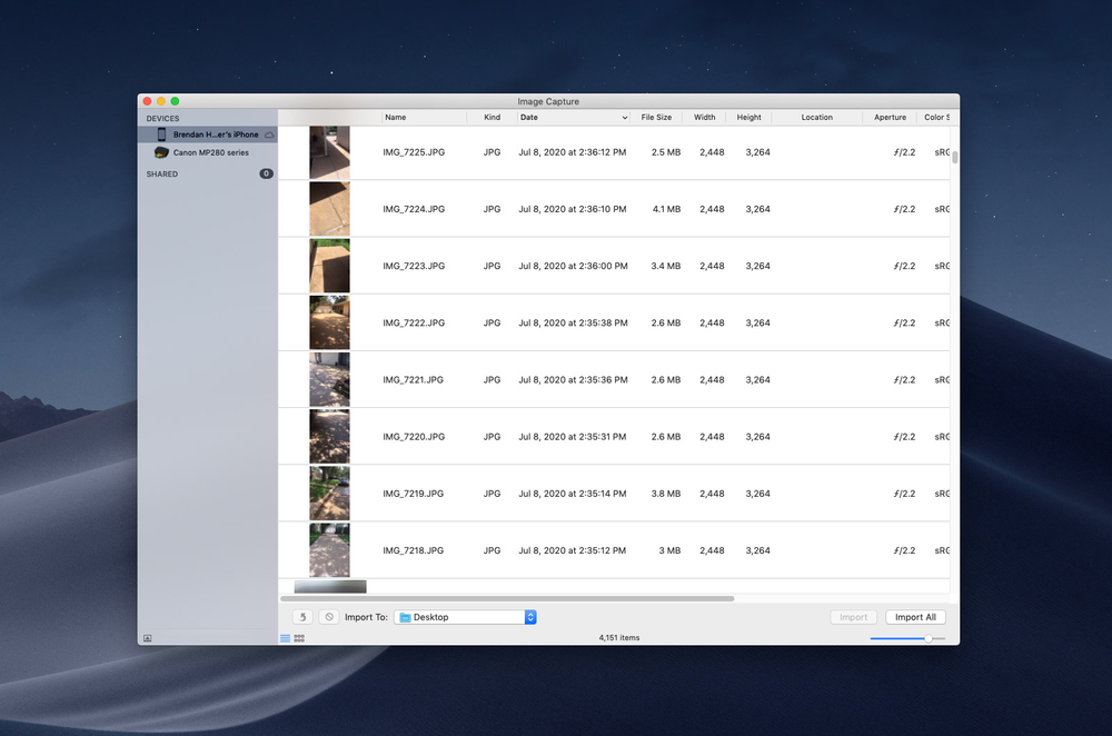 A computer screen shows a list of images on it