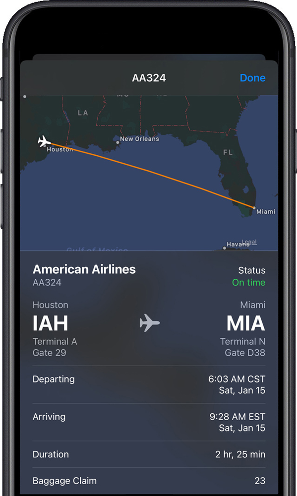 A cell phone screen shows a flight from miami to houston.