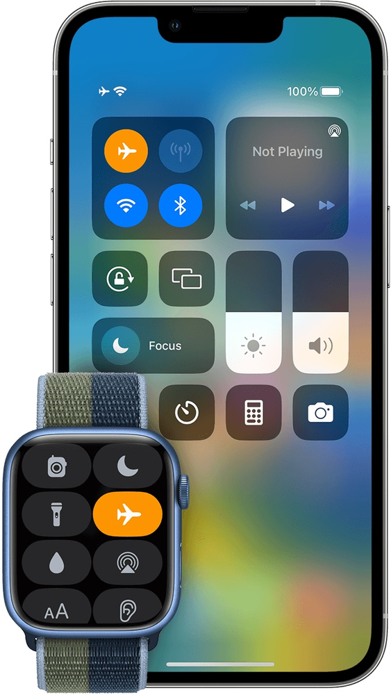 A smart watch is sitting next to a smart phone.