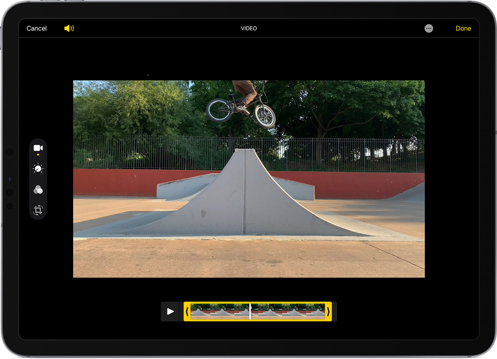 A person is riding a bike on a ramp on a tablet.
