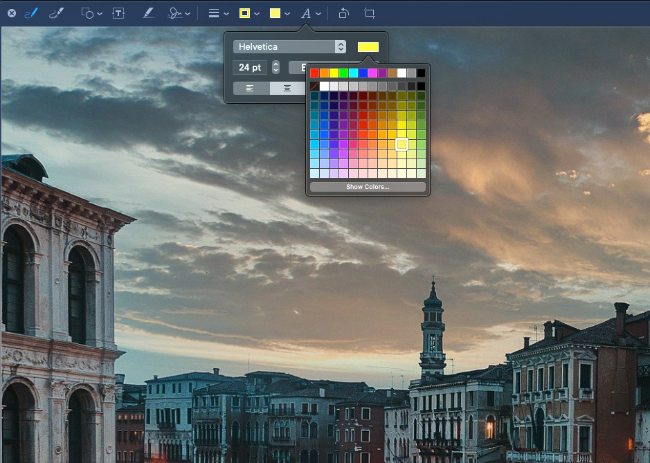 A computer screen with a picture of a city and a color palette.