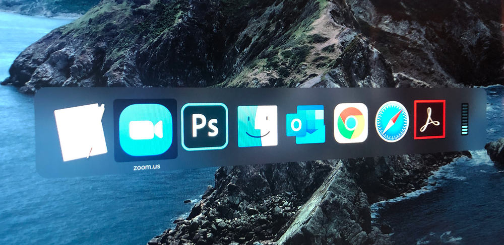 A computer screen shows icons for photoshop and adobe