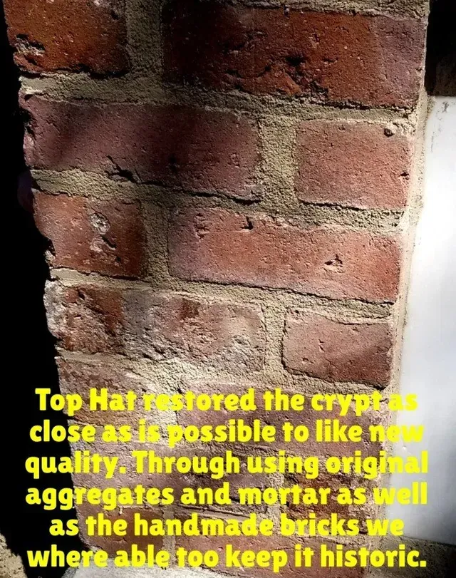 Close-up of a brick wall restored using original materials. Text describes the restoration of a crypt, emphasizing historical accuracy.