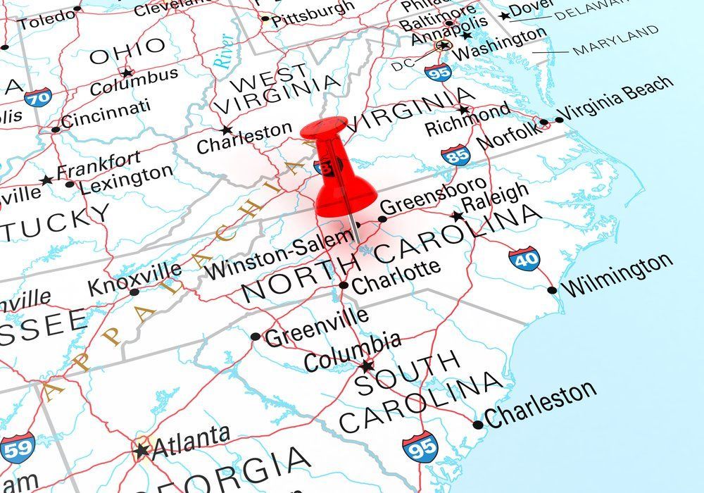 Map of the southeastern United States with a red pushpin in North Carolina.