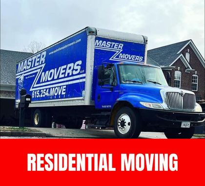 Professional movers carefully transporting household items during a residential move.