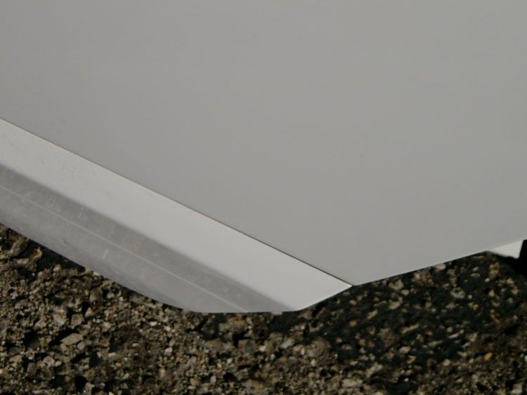 A white object is sitting on a pile of dirt