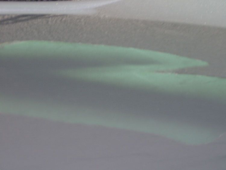 A close up of a person 's feet in a bathtub.