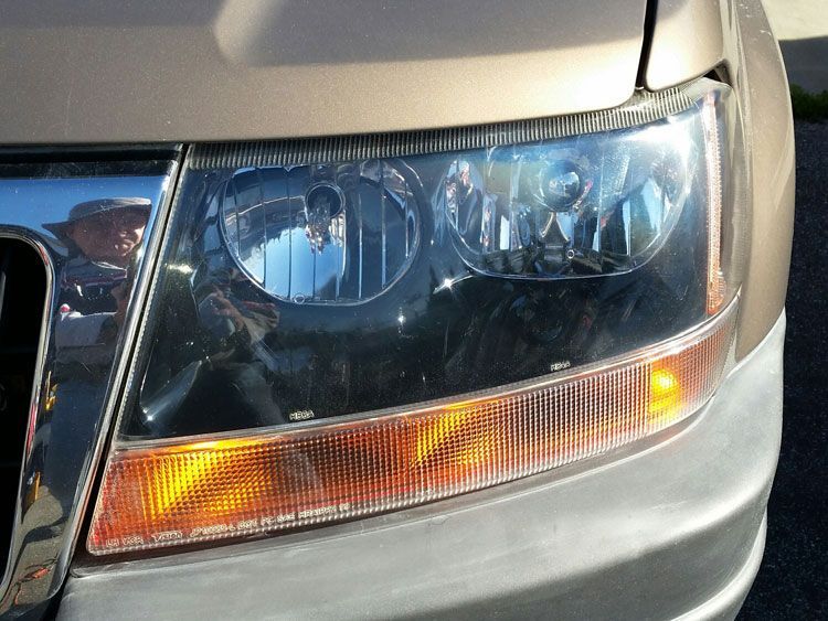 A close up of the headlight of a car